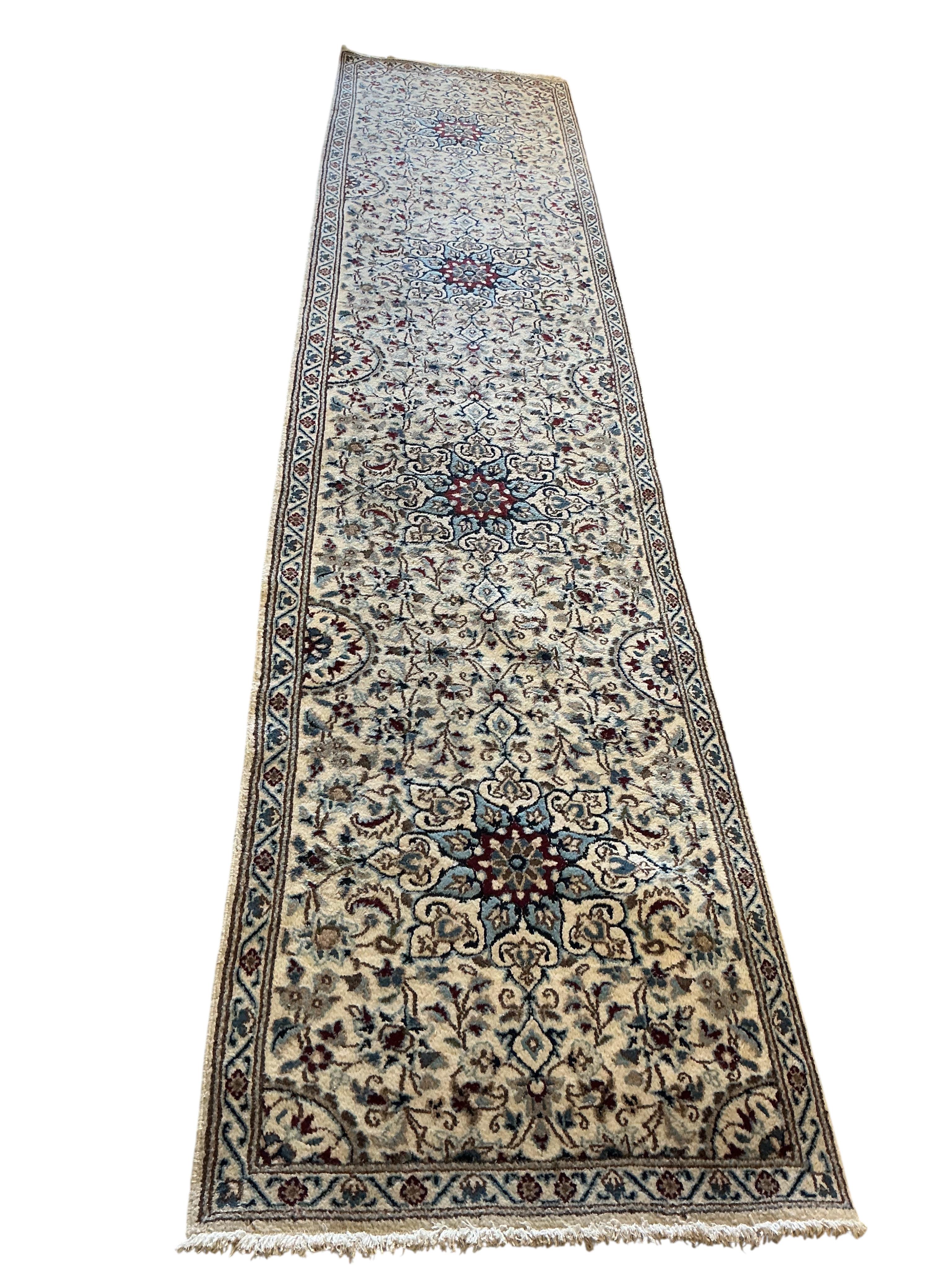 A Nain ivory ground runner, 386 x 86cm